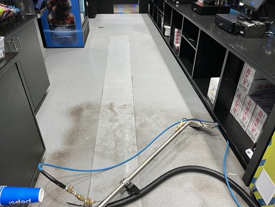 Floor cleaning equipment restoring a business workspace